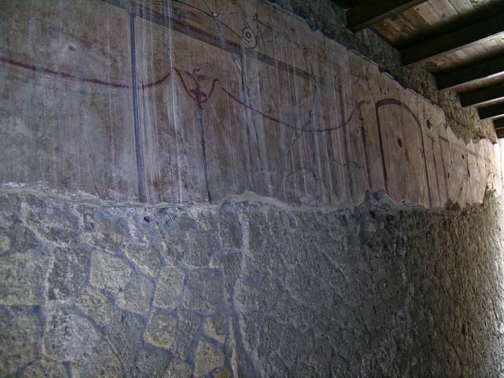 VI.13/11, Herculaneum. May 2004. west wall of corridor between tablinum and room on its west side, an oecus.
This corridor would have led from the atrium to the peristyle, but was later closed at the southern end.
Photo courtesy of Nicolas Monteix.